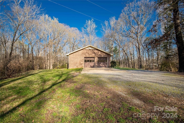 exterior space with a front yard and a garage