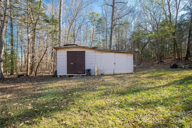 view of outdoor structure with a lawn