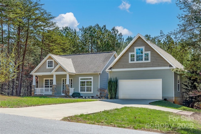 craftsman house with a garage, a front lawn, and a porch