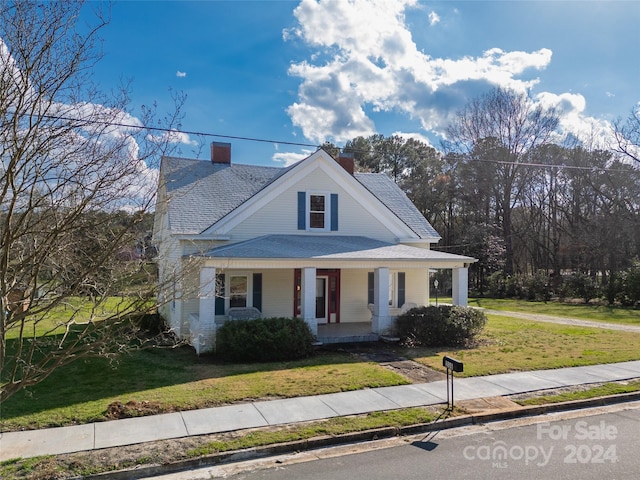 view of front of property with a front lawn and a porch