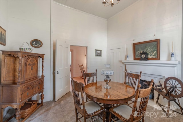 carpeted dining space with a notable chandelier