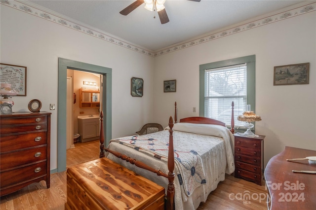 bedroom featuring ceiling fan, connected bathroom, and light hardwood / wood-style flooring