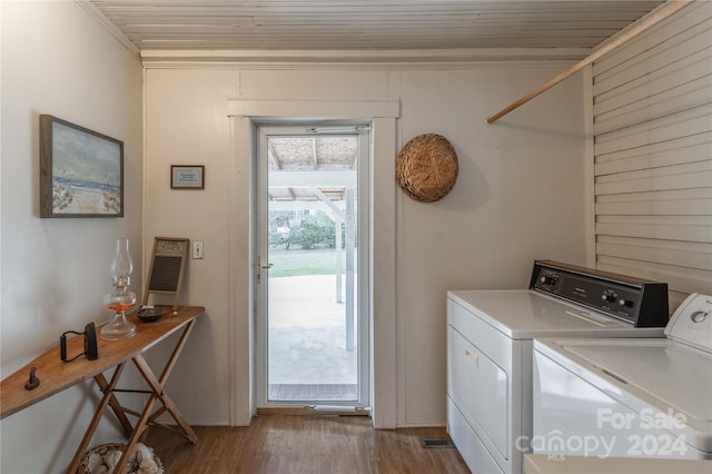 washroom with light hardwood / wood-style flooring, washer and clothes dryer, and wooden ceiling