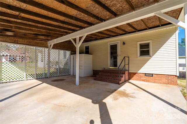 view of patio / terrace featuring a carport