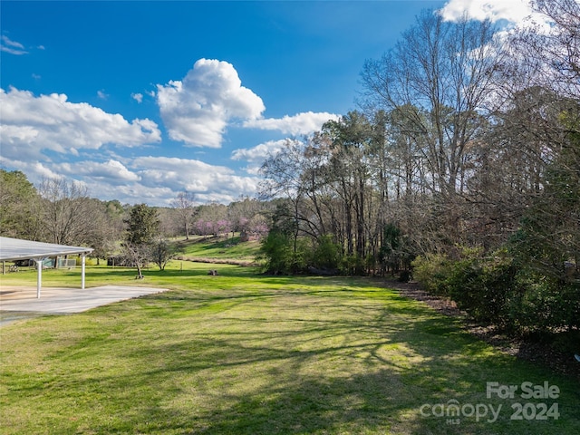 view of yard with a carport