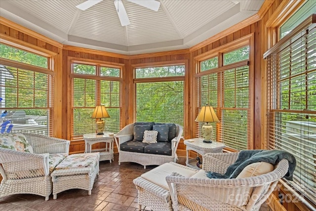 sunroom / solarium featuring ceiling fan