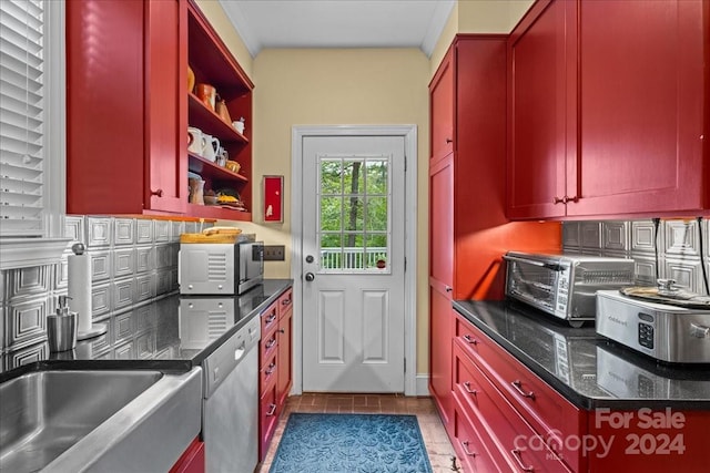 kitchen featuring backsplash, light tile flooring, stainless steel appliances, and dark stone countertops