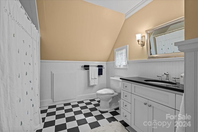 bathroom featuring lofted ceiling, toilet, tile floors, and vanity