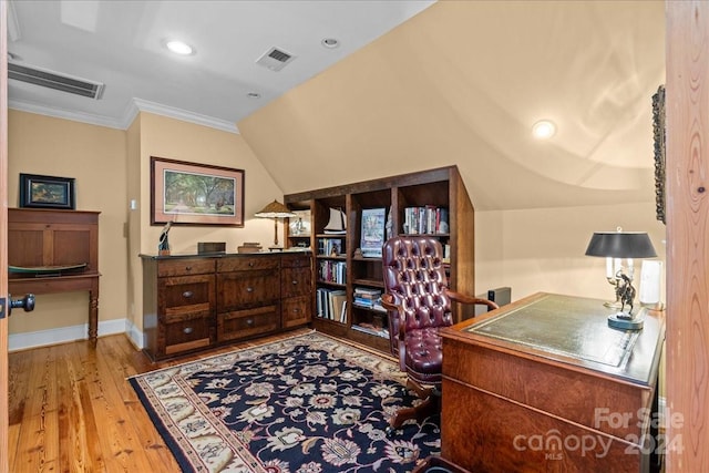 bedroom with ornamental molding and light hardwood / wood-style flooring