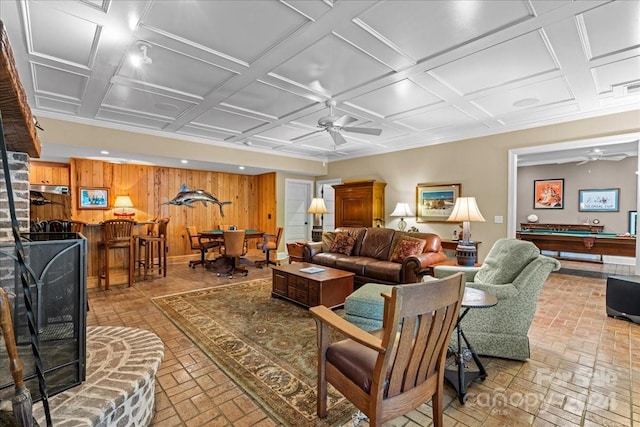 living room featuring coffered ceiling, wooden walls, pool table, and ceiling fan