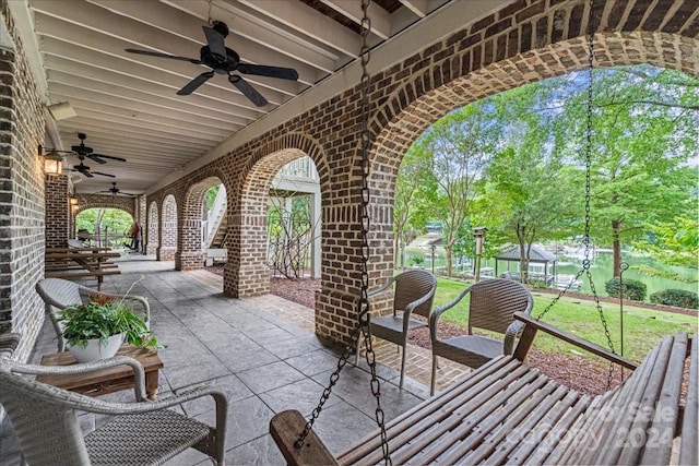 view of terrace featuring ceiling fan