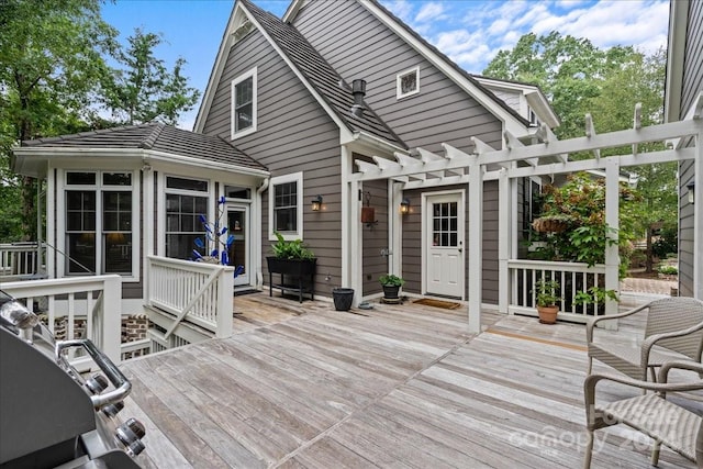 wooden deck featuring a pergola