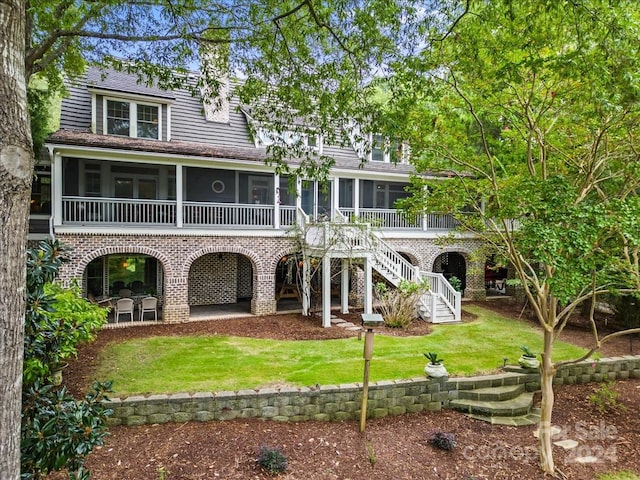 back of house with a patio and a yard