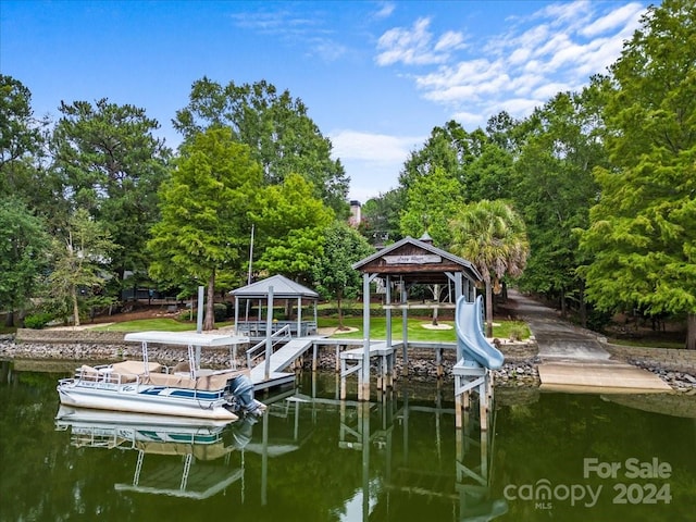 view of dock featuring a gazebo and a water view