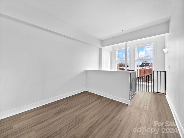 unfurnished room featuring wood-type flooring