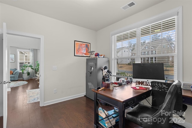 office with dark hardwood / wood-style flooring