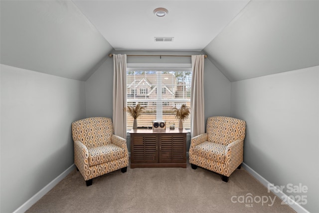 sitting room with carpet and lofted ceiling