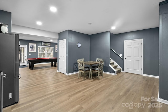 dining room featuring light hardwood / wood-style floors and pool table