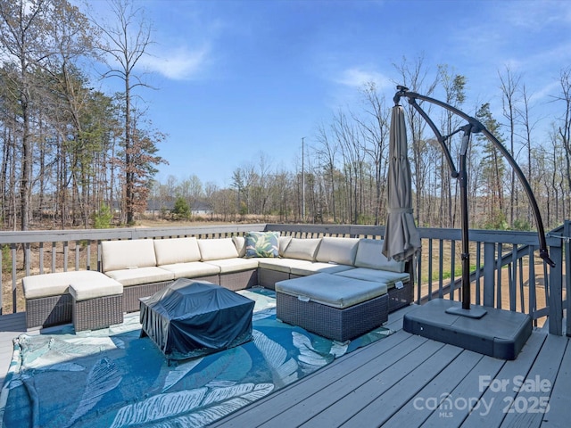 wooden deck with outdoor lounge area