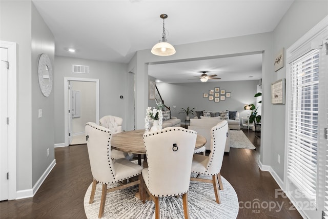 dining area featuring dark hardwood / wood-style flooring and ceiling fan