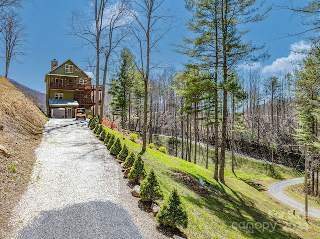 view of home's community featuring a wooden deck