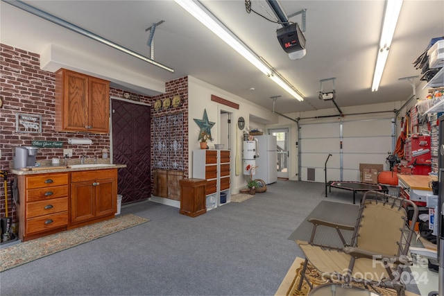 garage with sink, a garage door opener, and white fridge