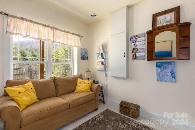 living room with light tile patterned floors