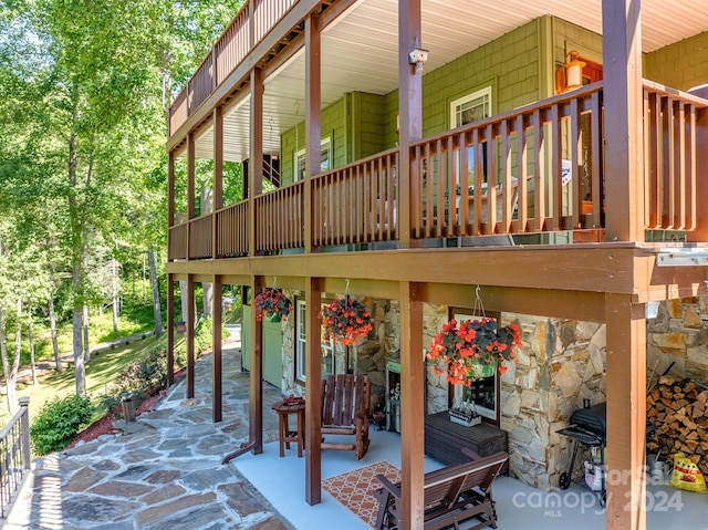 view of patio with a fireplace