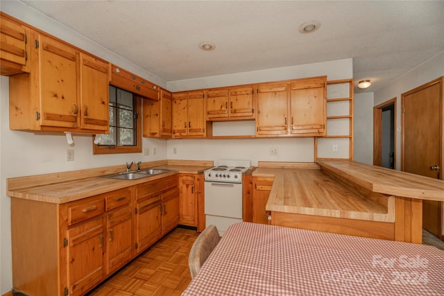 kitchen featuring light parquet flooring, white stove, a textured ceiling, and sink