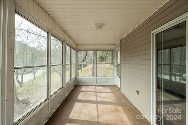 unfurnished sunroom featuring plenty of natural light