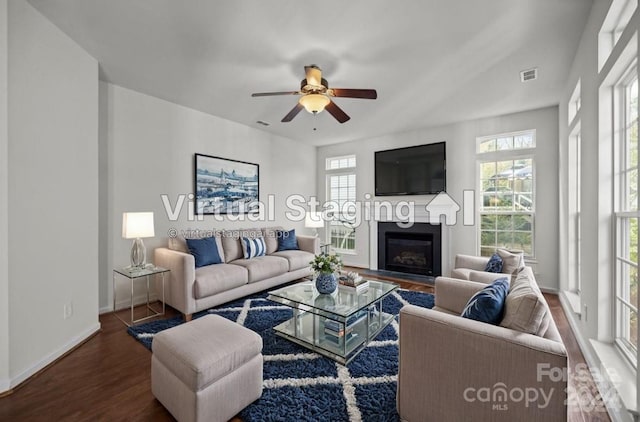 living room with ceiling fan, hardwood / wood-style flooring, and a healthy amount of sunlight