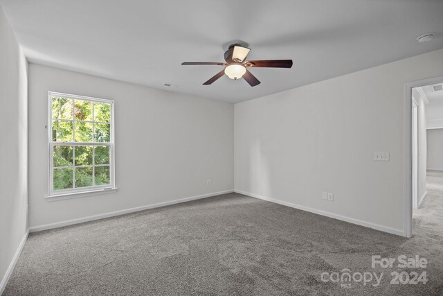 carpeted empty room with ceiling fan