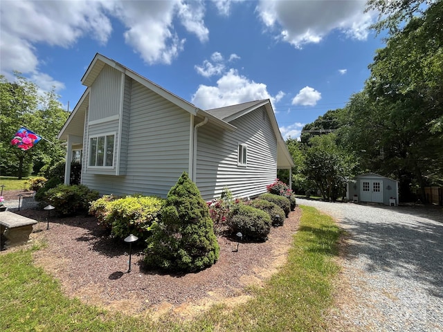 view of property exterior with a storage shed