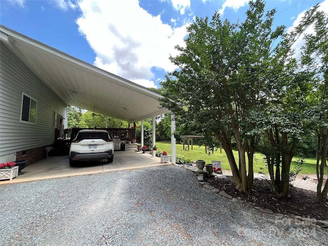 exterior space with a carport and a yard