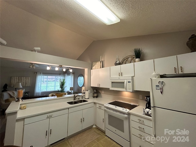 kitchen featuring lofted ceiling, white appliances, light tile floors, sink, and white cabinetry