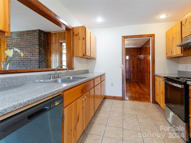 kitchen featuring sink, stainless steel range with electric stovetop, light tile floors, and dishwasher