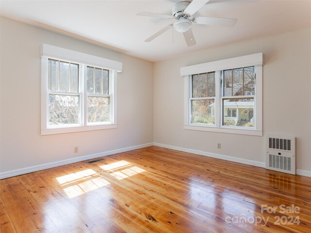 spare room featuring ceiling fan and light hardwood / wood-style flooring