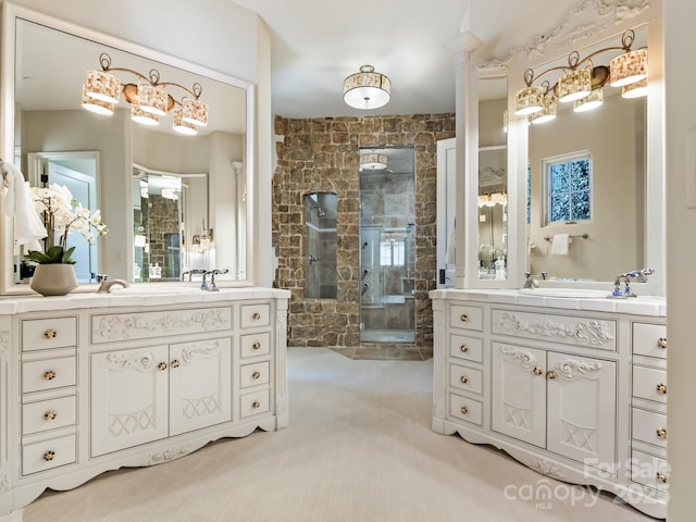 bathroom with a sink, a fireplace, two vanities, and a shower stall