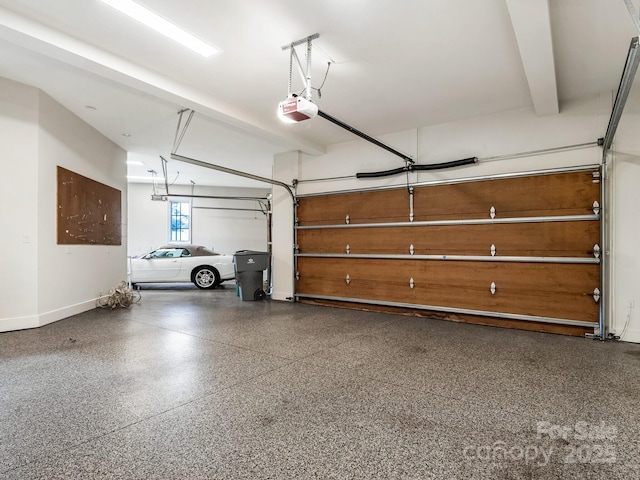 garage featuring baseboards and a garage door opener