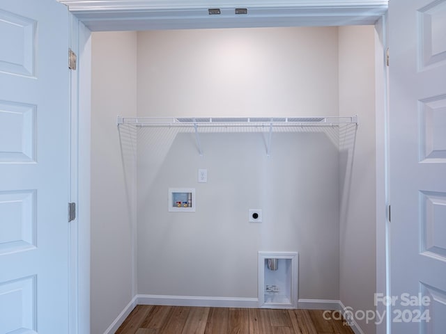 laundry room featuring hookup for an electric dryer, hardwood / wood-style floors, and hookup for a washing machine