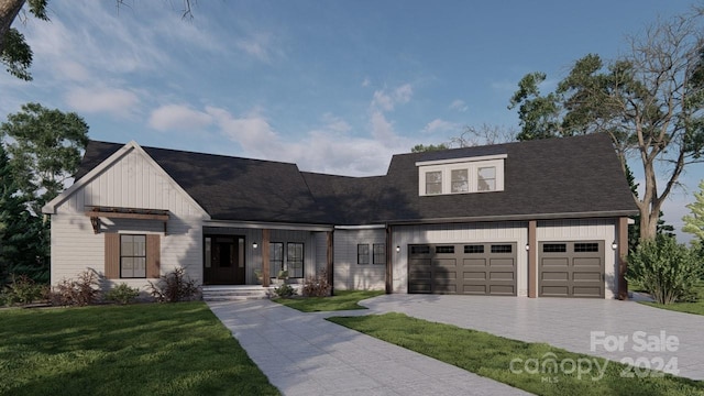 view of front facade with a front yard and a garage