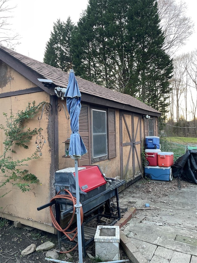 view of property exterior with a shed