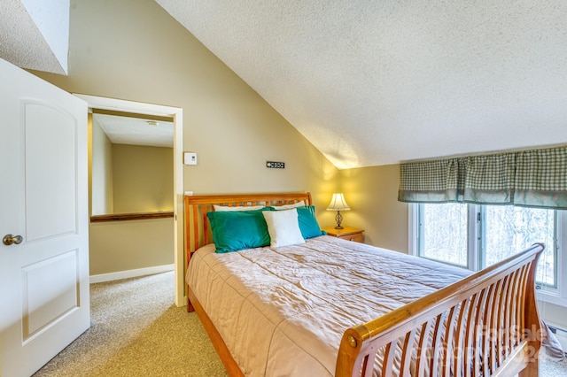 carpeted bedroom with a textured ceiling and vaulted ceiling