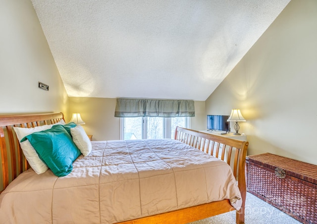 bedroom with light carpet, a textured ceiling, and vaulted ceiling