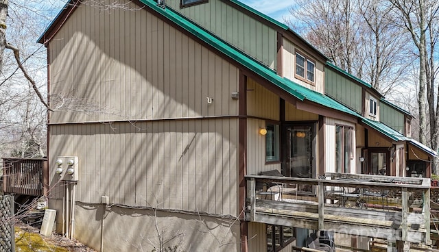 view of side of home featuring a deck