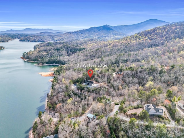 aerial view featuring a water and mountain view