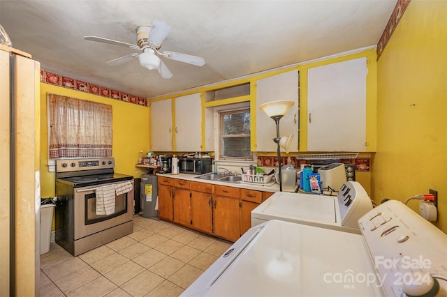 kitchen with separate washer and dryer, light tile floors, electric range, ceiling fan, and sink