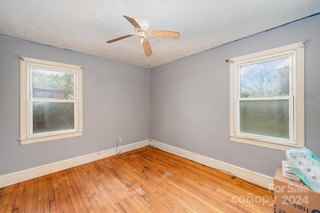 unfurnished room with ceiling fan and light hardwood / wood-style flooring