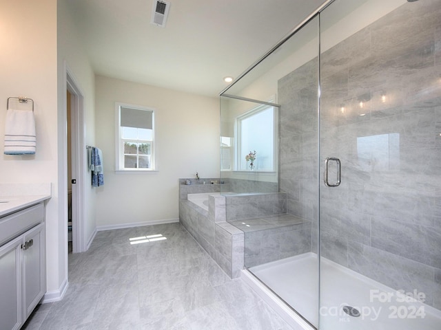 bathroom with vanity and walk in shower