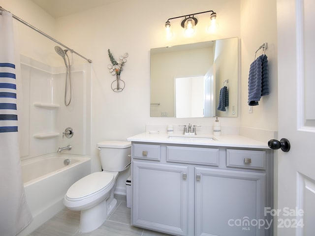 full bathroom with vanity, toilet, tile patterned flooring, and shower / bath combo with shower curtain